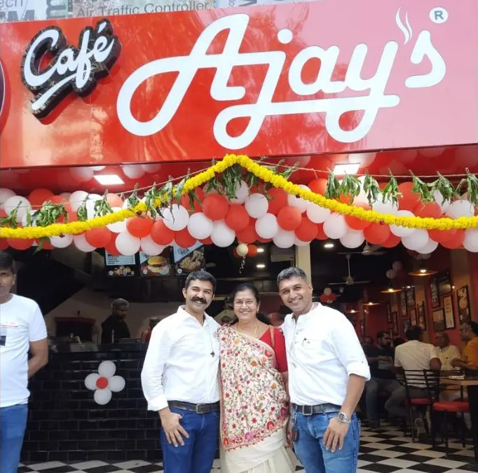 The founders of Ajay’s cafe outside their flagship outlet