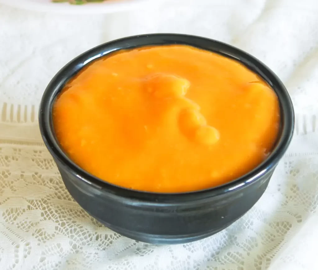 Fried poori served with sweet mango pulp and aamras