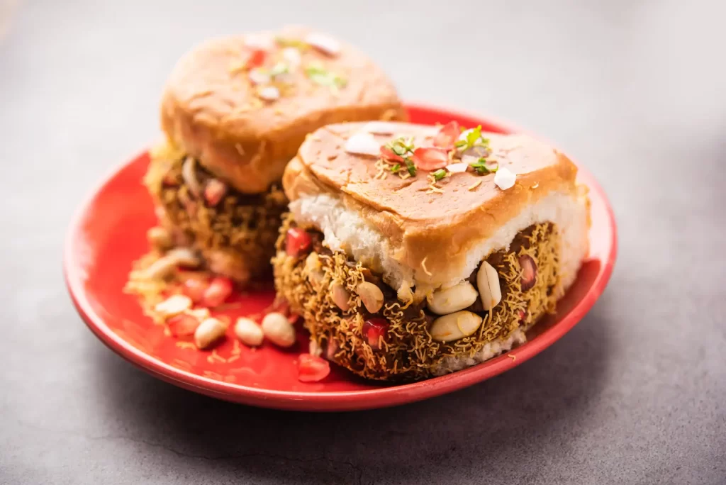 A double bread with potato patty and vegetables between it