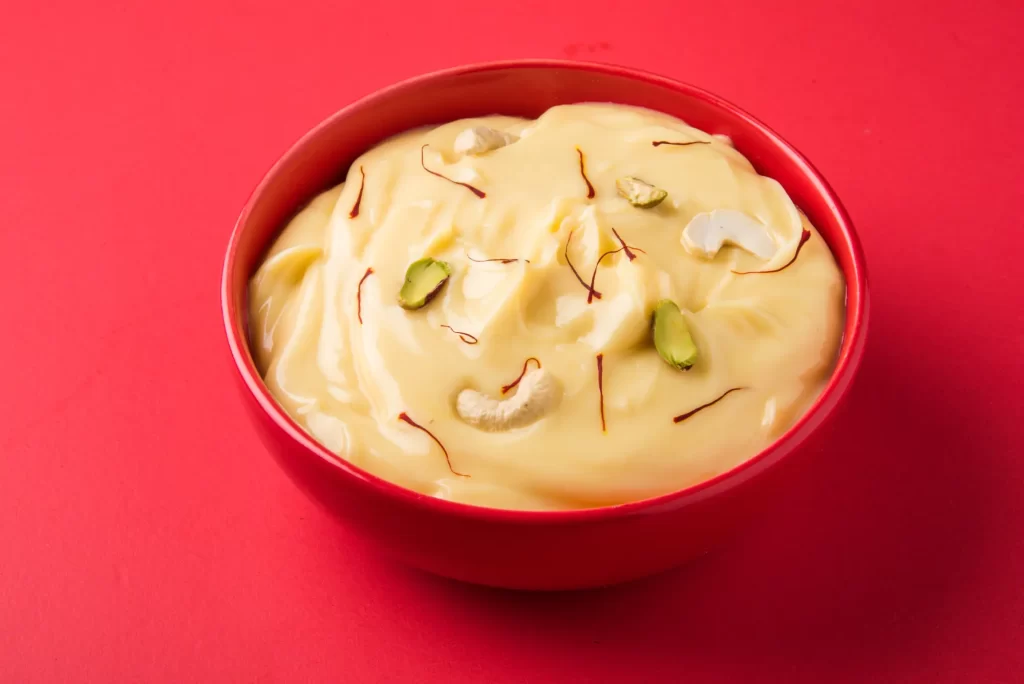 An Indian sweet dish made with strained yoghurt and garnished with dry fruits