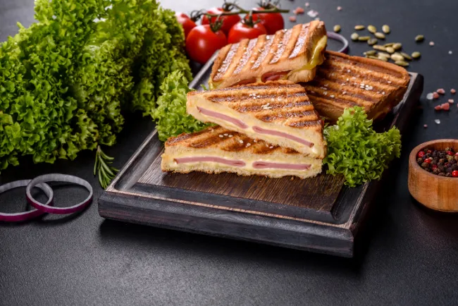 Grilled sandwich placed on a chopping board