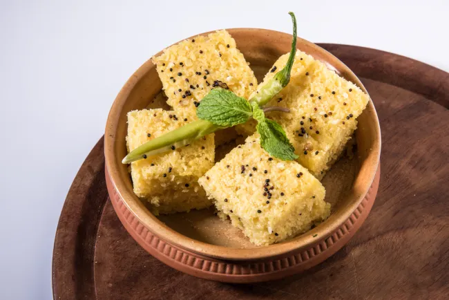 Khaman served with fried green chilli